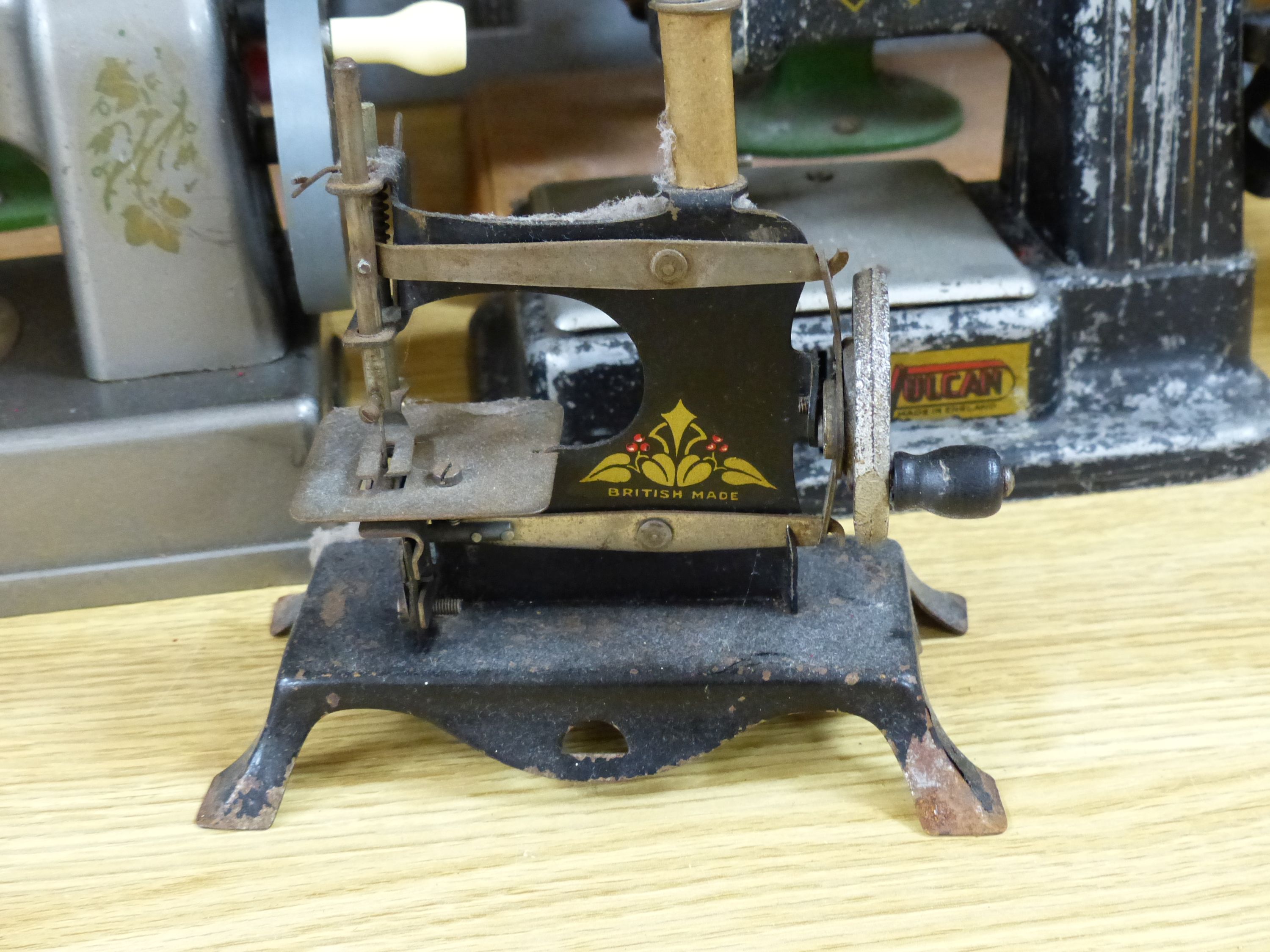 Six miniature sewing machines